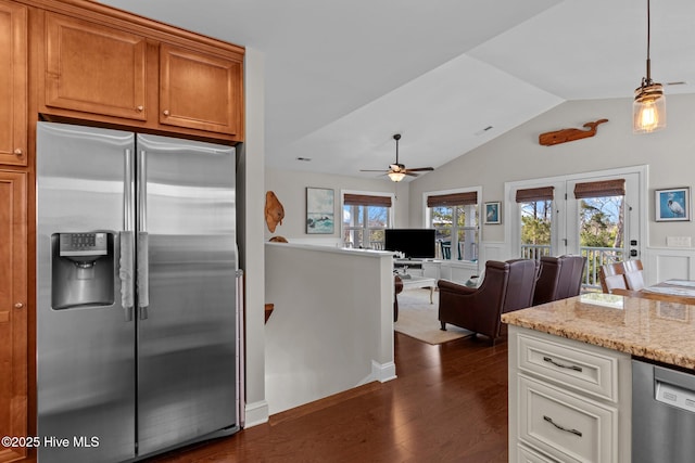 kitchen with stainless steel appliances, a ceiling fan, dark wood-style floors, light stone countertops, and lofted ceiling