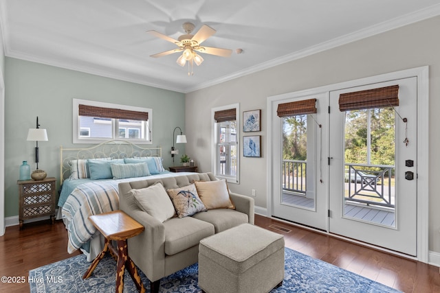 bedroom with crown molding, access to exterior, dark wood-style flooring, and visible vents