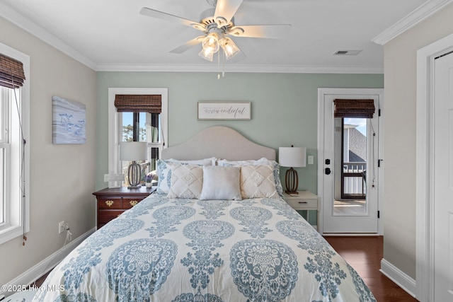 bedroom with visible vents, baseboards, crown molding, dark wood-type flooring, and access to exterior