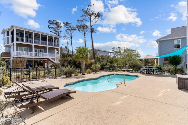 view of pool with a patio area, a fenced in pool, and fence