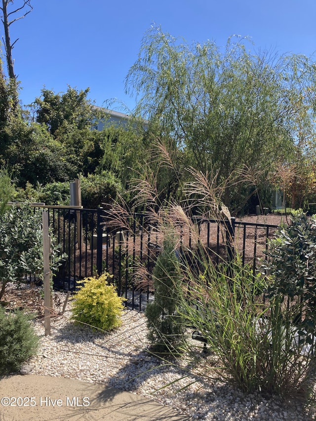 view of gate with fence