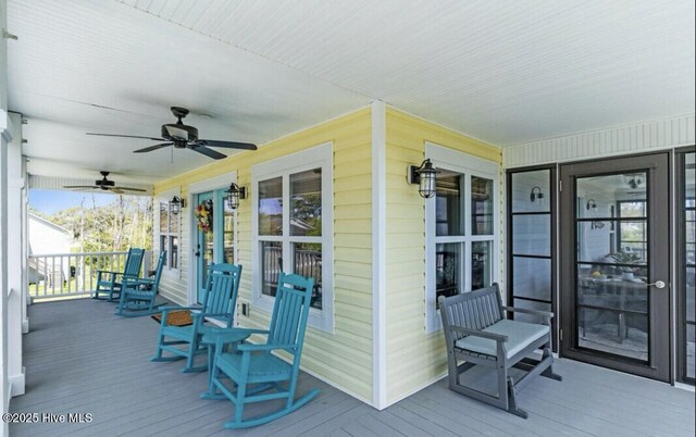 deck with a porch and ceiling fan