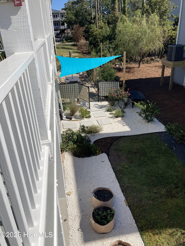 view of yard featuring central air condition unit
