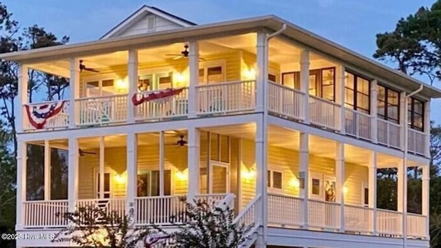 exterior space featuring a ceiling fan