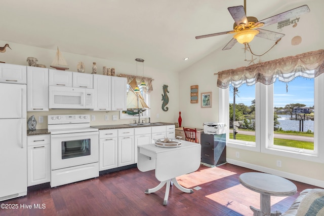 kitchen featuring a sink, white appliances, a ceiling fan, dark wood-type flooring, and vaulted ceiling