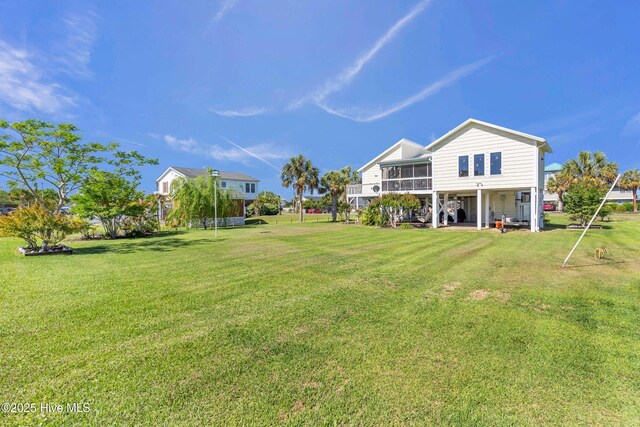 back of property with a lawn