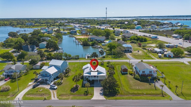 birds eye view of property featuring a residential view and a water view