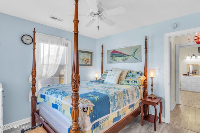 bedroom with visible vents, baseboards, ceiling fan, and wood finished floors