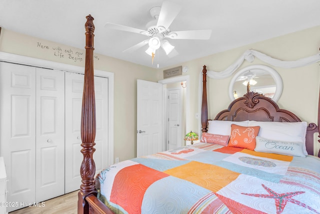 bedroom with ceiling fan, a closet, and light wood finished floors