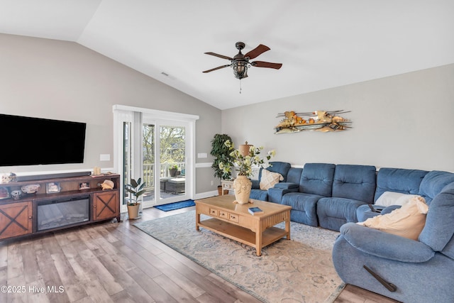 107 SW 25th St, Oak Island, NC 28465 - living area featuring a ceiling fan, visible vents, wood finished floors, and lofted ceiling