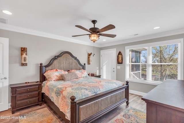 107 SW 25th St, Oak Island, NC 28465 - bedroom with crown molding, light wood-type flooring, and visible vents