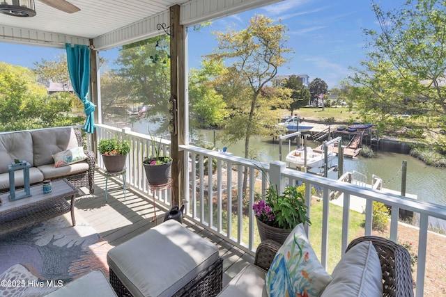 107 SW 25th St, Oak Island, NC 28465 - sunroom / solarium with ceiling fan, a water view, and outdoor lounge area