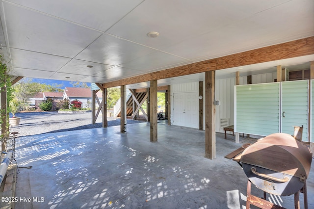 107 SW 25th St, Oak Island, NC 28465 - view of patio featuring stairs, visible vents, and a carport