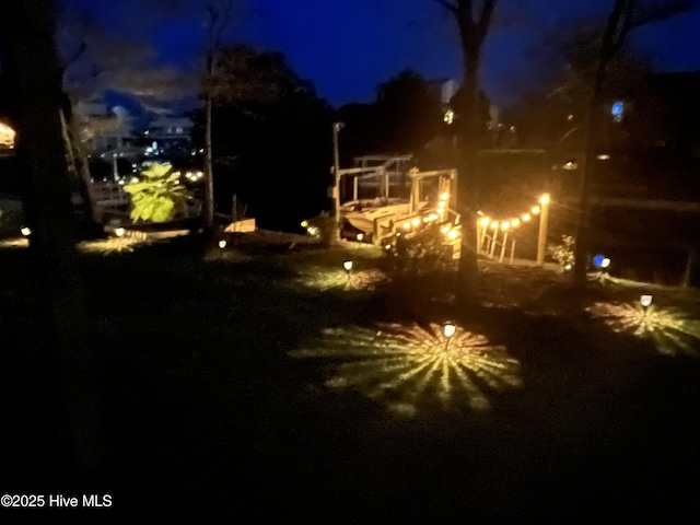 107 SW 25th St, Oak Island, NC 28465 - view of yard at twilight