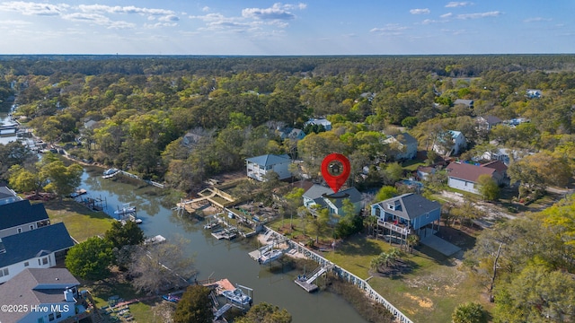 107 SW 25th St, Oak Island, NC 28465 - bird's eye view featuring a wooded view, a water view, and a residential view