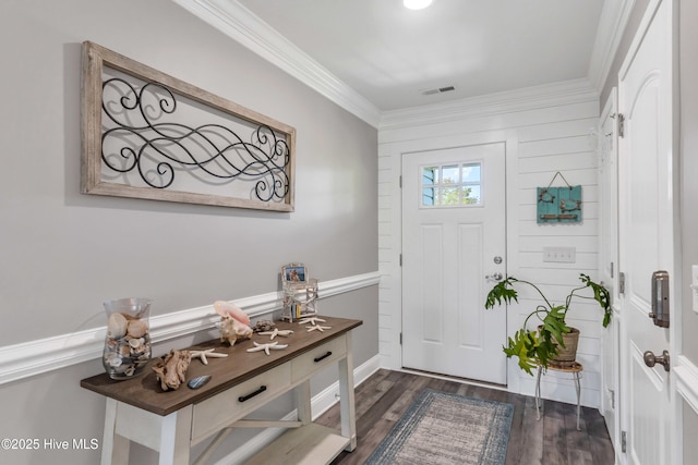 107 SW 25th St, Oak Island, NC 28465 - entrance foyer featuring crown molding, visible vents, and dark wood-type flooring