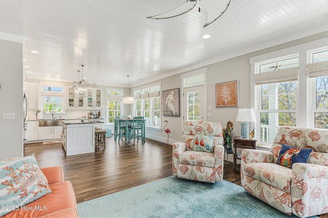 117 NW 2nd St, Oak Island, NC 28465 - living room featuring baseboards, dark wood-style floors, and recessed lighting