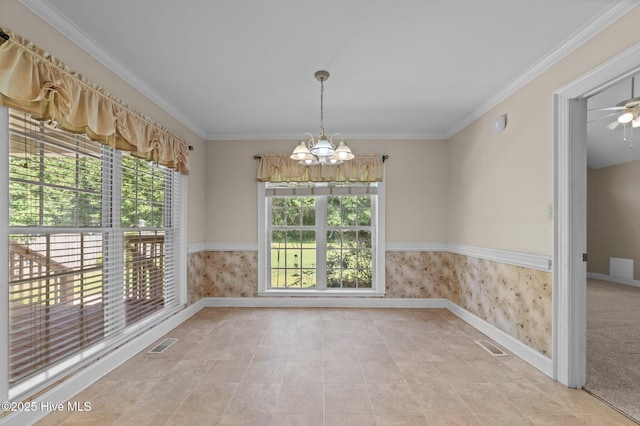 unfurnished dining area featuring baseboards, visible vents, and ornamental molding