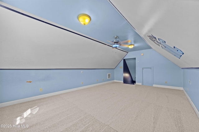 bonus room featuring baseboards, ceiling fan, carpet, and vaulted ceiling