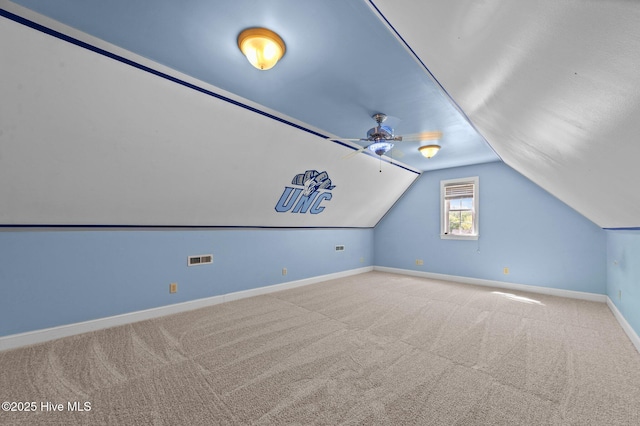 bonus room featuring ceiling fan, carpet, baseboards, lofted ceiling, and visible vents