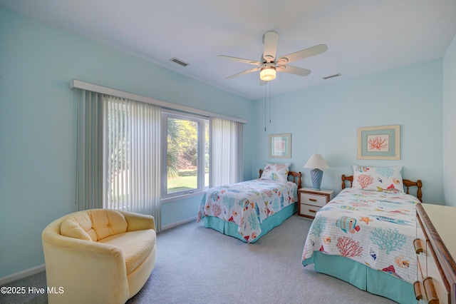 carpeted bedroom with baseboards, visible vents, and ceiling fan