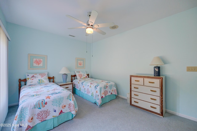 carpeted bedroom with baseboards, visible vents, a ceiling fan, and a closet