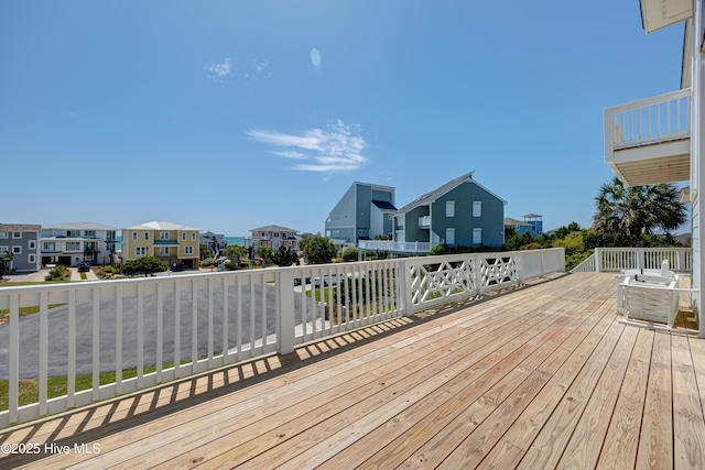 wooden terrace featuring a residential view