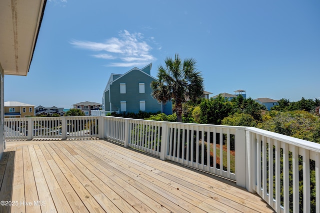 wooden deck with a residential view