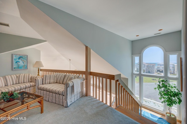 living room with carpet and visible vents