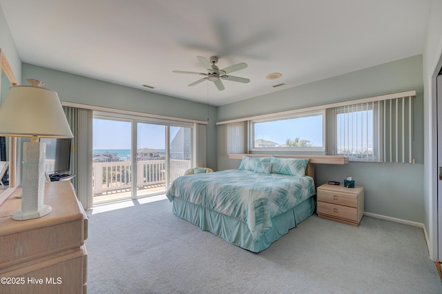 bedroom featuring carpet floors, access to outside, baseboards, visible vents, and a ceiling fan