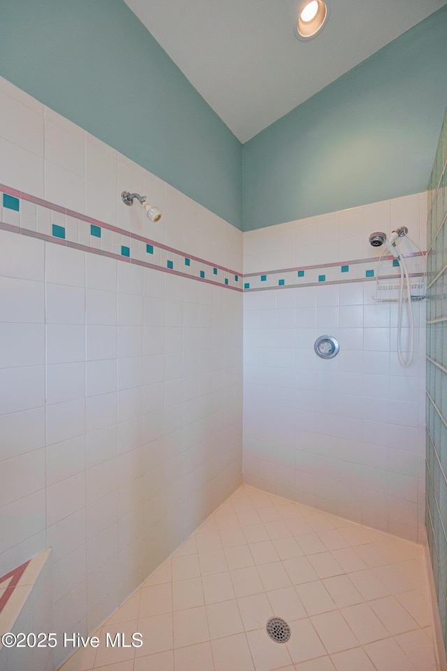 bathroom featuring recessed lighting and a tile shower