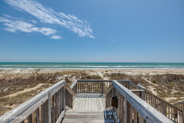 view of community with a view of the beach and a water view