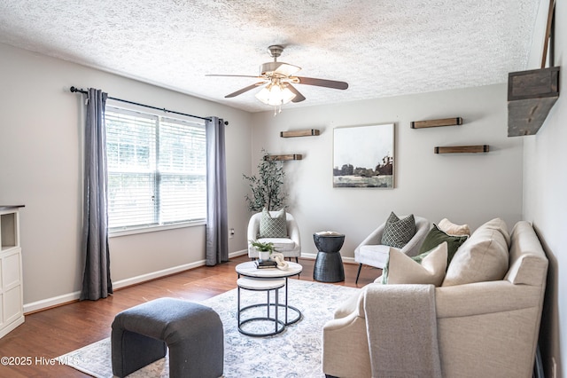 4915 Beulah Hill Church Rd, West End, NC 27376 - living area featuring a ceiling fan, wood finished floors, a textured ceiling, and baseboards