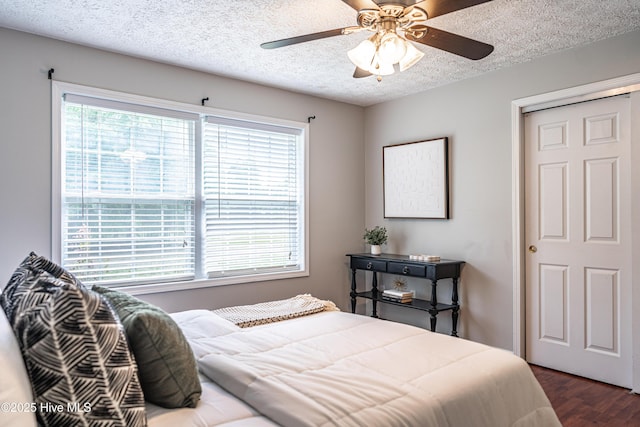 4915 Beulah Hill Church Rd, West End, NC 27376 - bedroom with dark wood finished floors, a textured ceiling, and a ceiling fan