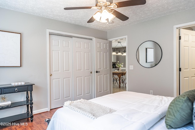 4915 Beulah Hill Church Rd, West End, NC 27376 - bedroom featuring a closet, wood finished floors, a textured ceiling, ceiling fan, and baseboards