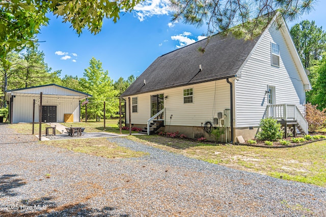 4915 Beulah Hill Church Rd, West End, NC 27376 - back of house with an outbuilding, roof with shingles, crawl space, and entry steps