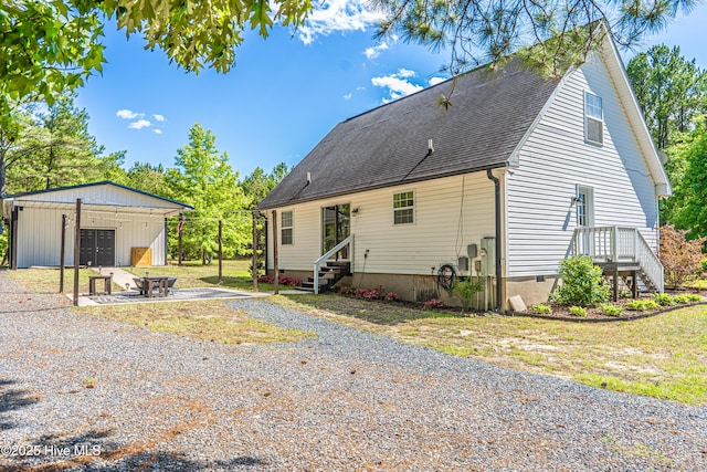4915 Beulah Hill Church Rd, West End, NC 27376 - rear view of house featuring an outbuilding, roof with shingles, and entry steps