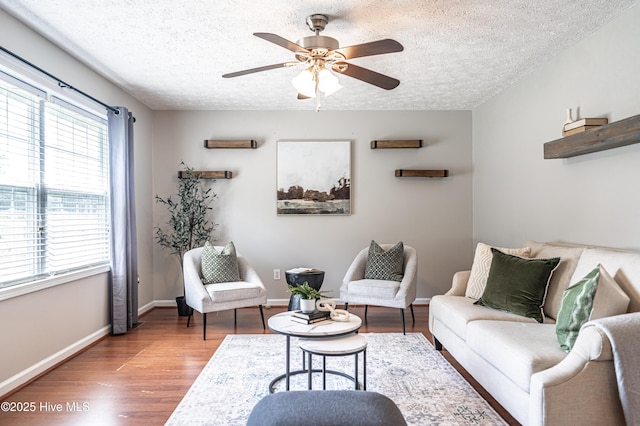 4915 Beulah Hill Church Rd, West End, NC 27376 - living area featuring wood finished floors, a ceiling fan, a textured ceiling, and baseboards
