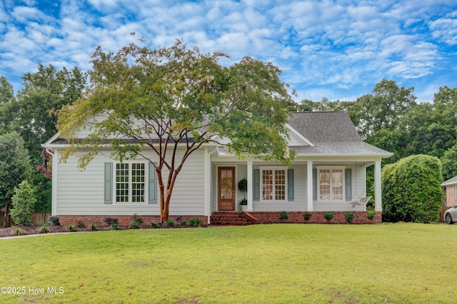 226 Bayfield Dr, Wilmington, NC 28411 - view of front of home featuring a front yard, a porch, and a shingled roof