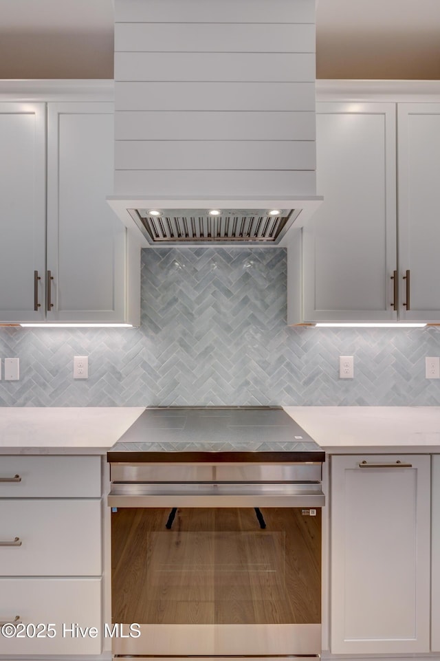 226 Bayfield Dr, Wilmington, NC 28411 - kitchen with tasteful backsplash, light countertops, and white cabinets