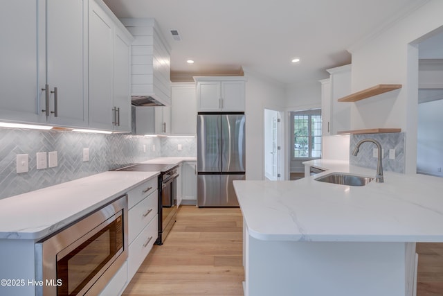 226 Bayfield Dr, Wilmington, NC 28411 - kitchen featuring stainless steel appliances, open shelves, a peninsula, white cabinetry, and recessed lighting
