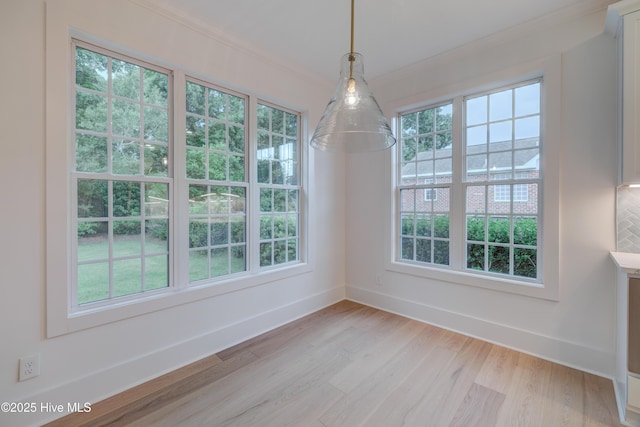226 Bayfield Dr, Wilmington, NC 28411 - unfurnished dining area with light wood finished floors, ornamental molding, and healthy amount of natural light