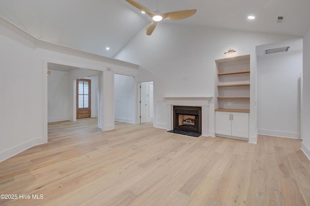 226 Bayfield Dr, Wilmington, NC 28411 - unfurnished living room with a ceiling fan, a fireplace with flush hearth, light wood-style floors, high vaulted ceiling, and recessed lighting