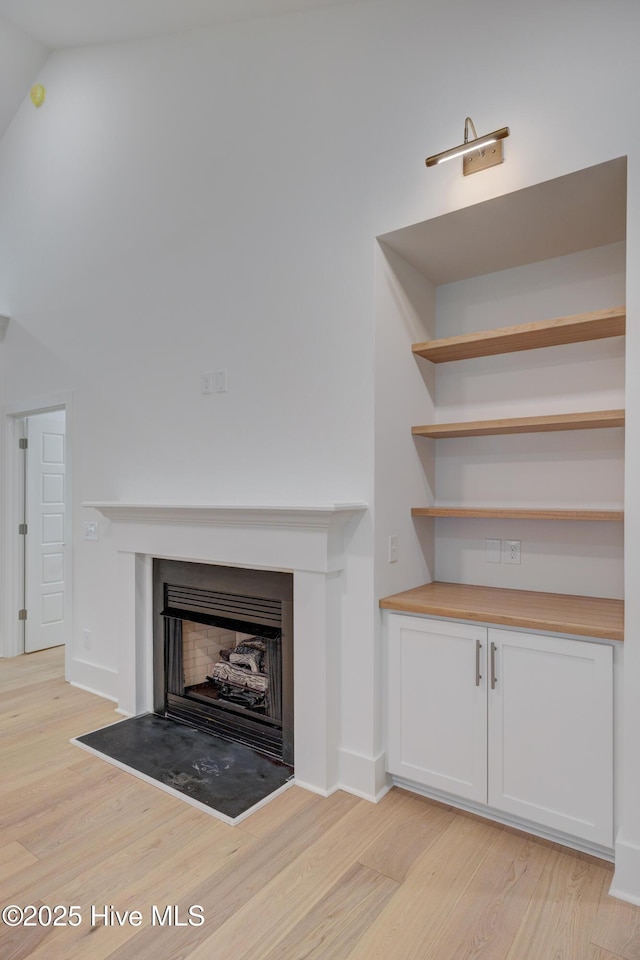 226 Bayfield Dr, Wilmington, NC 28411 - detailed view of wood finished floors and a fireplace