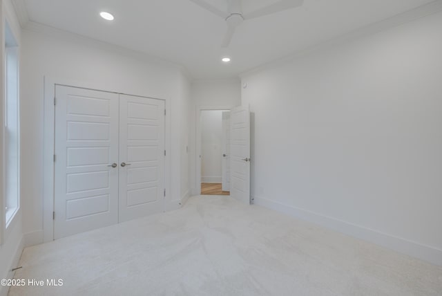 226 Bayfield Dr, Wilmington, NC 28411 - unfurnished bedroom with carpet flooring, crown molding, recessed lighting, a closet, and a ceiling fan