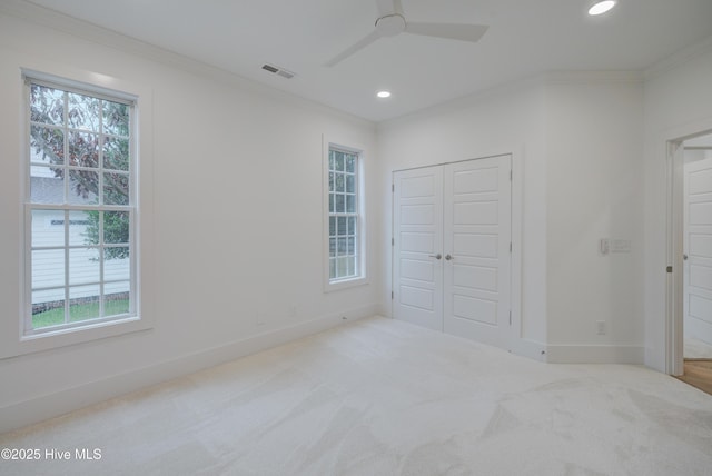 226 Bayfield Dr, Wilmington, NC 28411 - unfurnished bedroom featuring crown molding, recessed lighting, a closet, carpet, and a ceiling fan