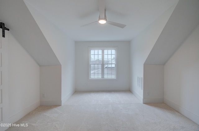 226 Bayfield Dr, Wilmington, NC 28411 - additional living space featuring carpet floors, a ceiling fan, a barn door, and lofted ceiling