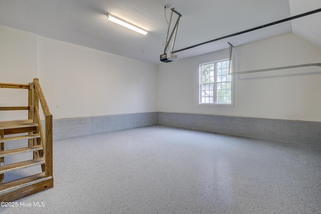226 Bayfield Dr, Wilmington, NC 28411 - garage featuring a garage door opener and concrete block wall