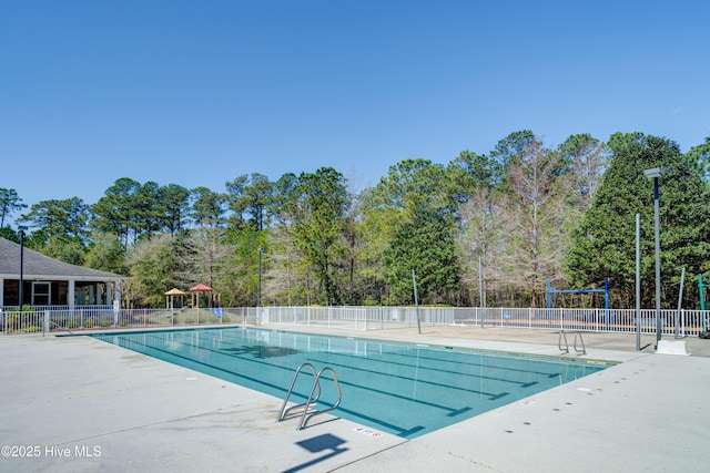 226 Bayfield Dr, Wilmington, NC 28411 - community pool featuring a patio area and view of scattered trees