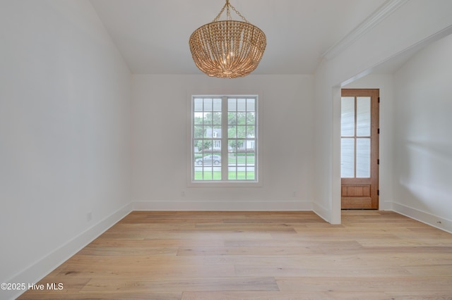 226 Bayfield Dr, Wilmington, NC 28411 - spare room with a chandelier and light wood-style flooring